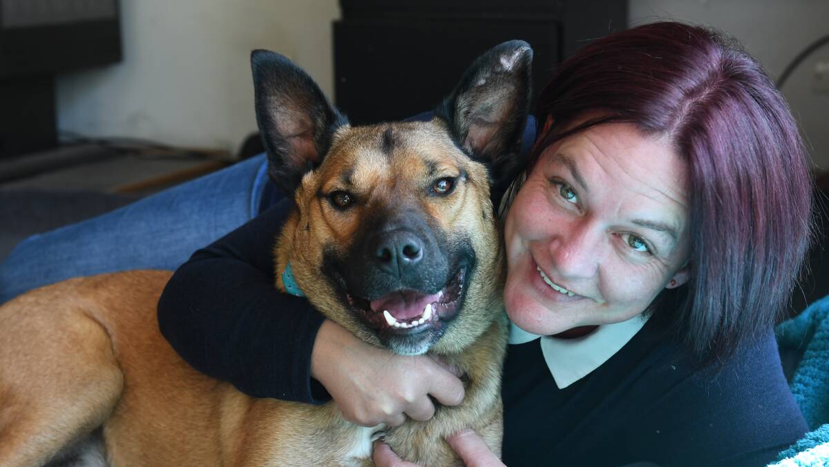 LOVING HOME: Batdog, now known as Lincoln, and his new owner Kristy Ashley are participating in the Million Paws Walk next month. Picture: Lachlan Bence
