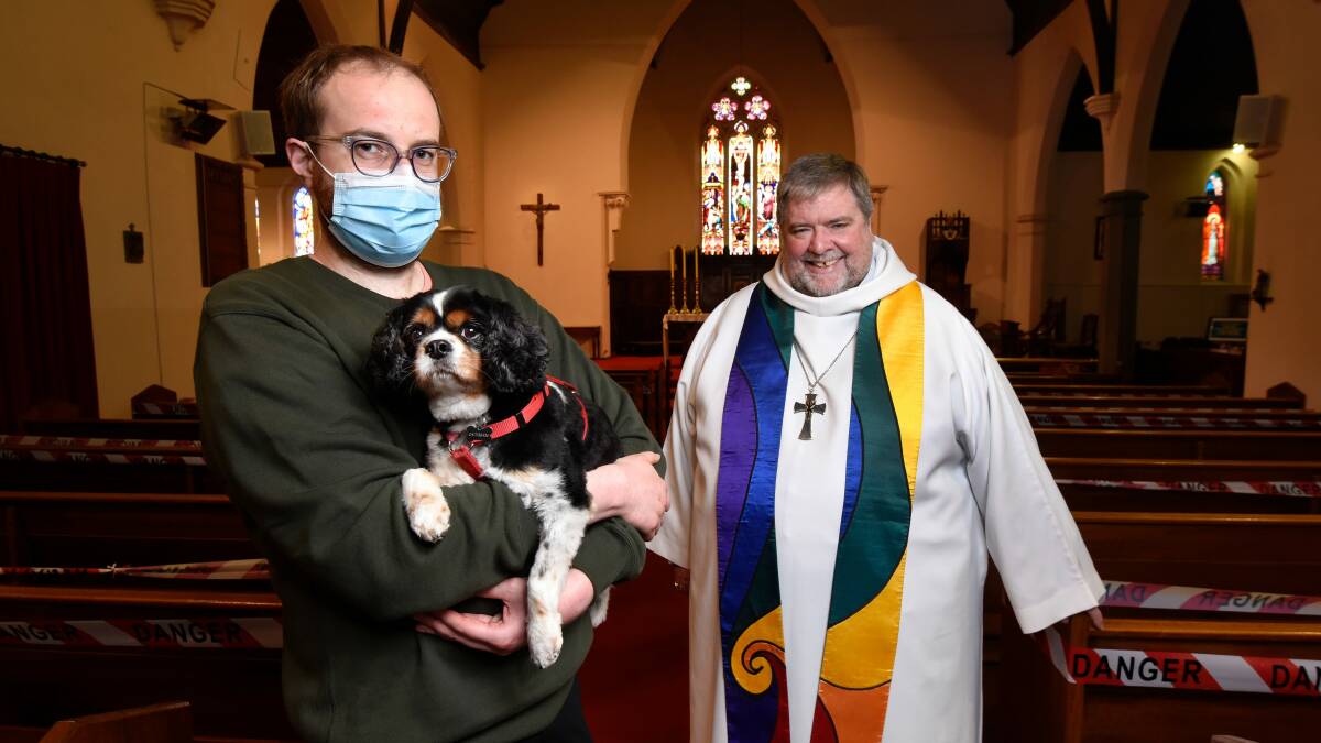 ALL CREATURES GREAT AND SMALL: Joseph Huntley with Lexie and Bishop Garry Weatherill at the Anglican Cathedral Church of Christ the King which is raising money for the Ballarat Wildlife Park as part of the Feast of Saint Francis of Assisi. Picture: Adam Trafford