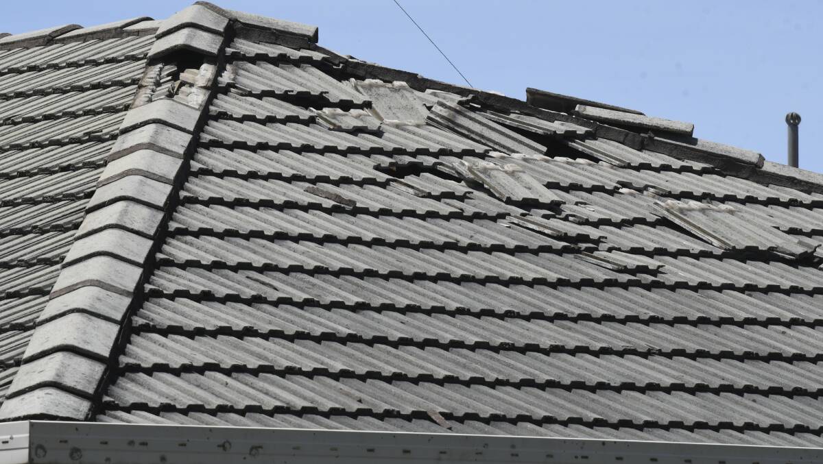 Damage could be seen all over the roof of the house. Picture: Lachlan Bence