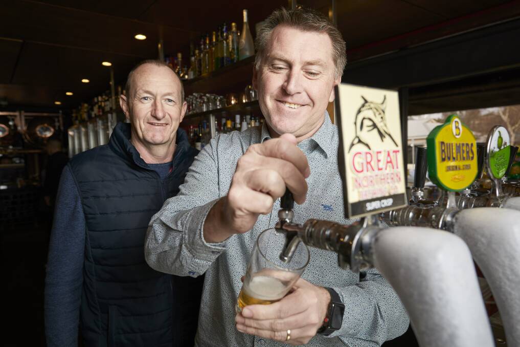 The Red Lion Hotel is among the Ballarat pubs running a fundraiser through the Great Northern Brewing Company to help farmers. Vin Armstrong (C.U.B) and David Canny from Red Lion prepare a brew. Picture: Luka Kauzlaric