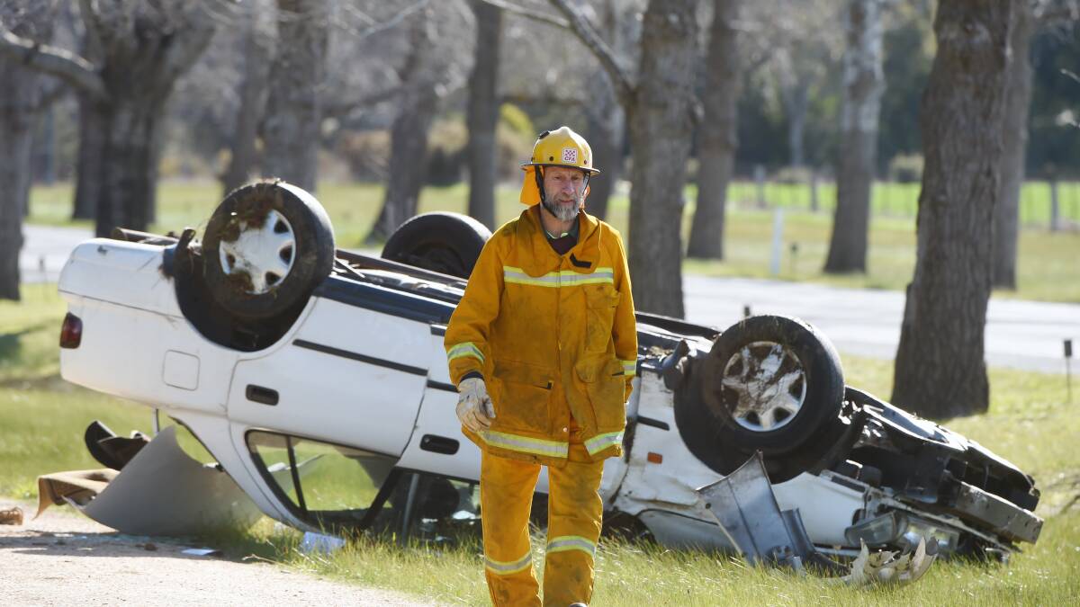 A driver has escaped with just leg injuries after a rollover on Remembrance Drive Cardigan on Friday afternoon. Pictures: Kate Healy
