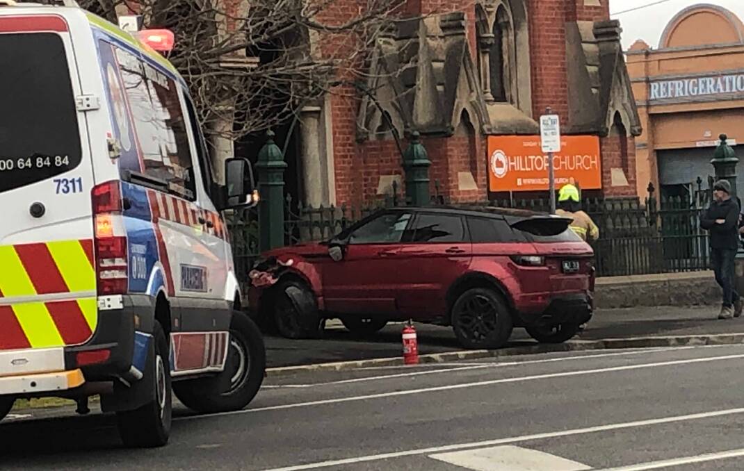 The stolen maroon Range Rover which ended up in a fence at the corner of Mair and Dawson streets on Tuesday morning. Picture: Greg Gliddon