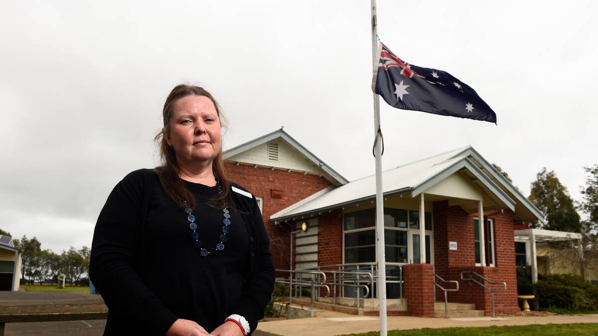 RESPECT: Bungaree Primary School principal Catherine Barnes in front of the Australian flag which was lowered to half mast. Picture: Adam Trafford