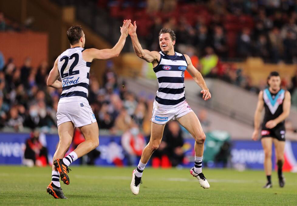 Mitch Duncan (22) and Isaac Smith will look to renew old rivalries on Friday night when the Cats take on the Power. Picture: Getty Images
