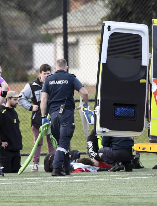 Paramedics attended to the injured Ballarat SC player on Sunday at Morshead Park. Picture: Lachlan Bence