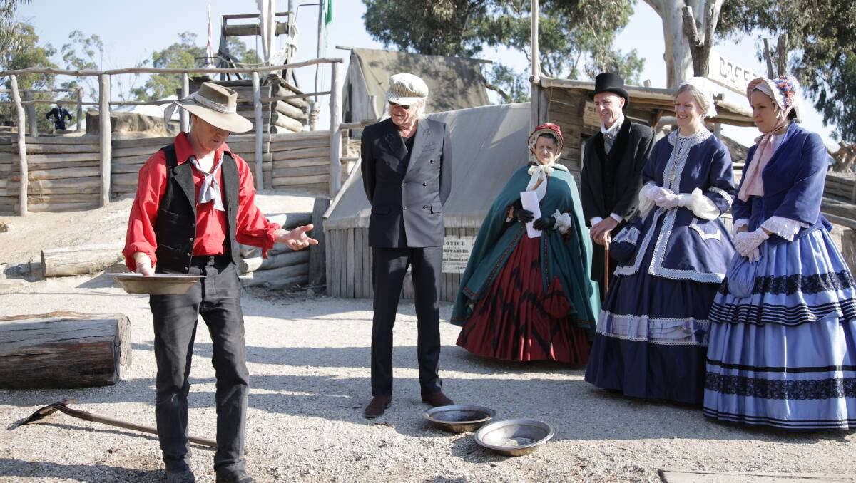 Sir Bob Geldof learns about panning for gold at Sovereign Hill on Saturday. Picture: Andrew Wilson