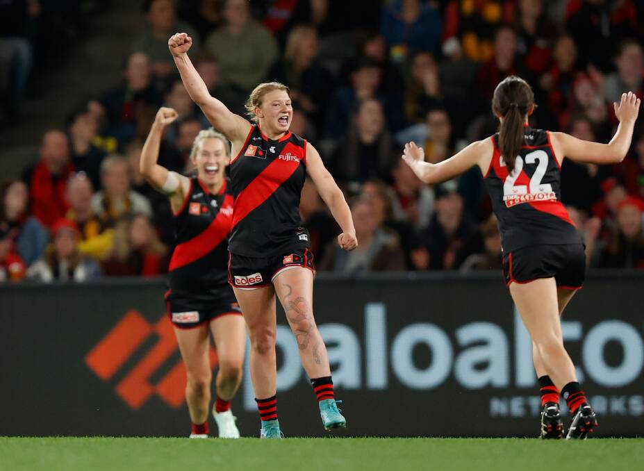 Paige Scott celebrates her goal in Essendon's debut win over Hawthorn on Saturday night. Picture by Getty Images