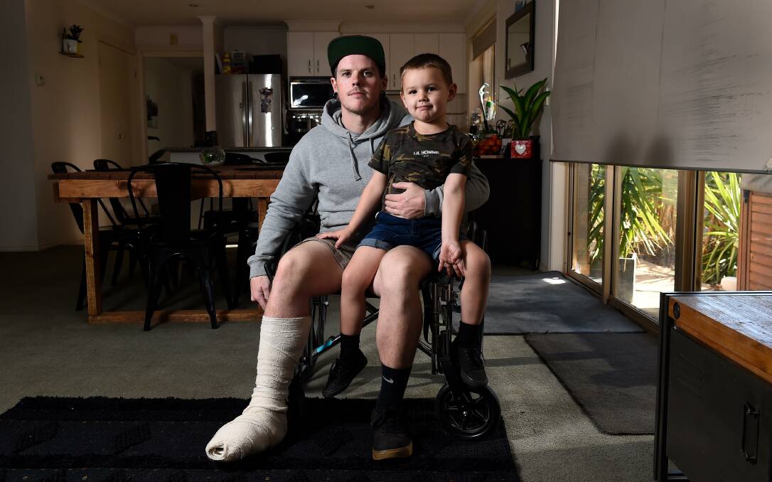 How do you tell a three-year-old you won't be able to go riding with him? Jack Jones and son Deegan. Picture: Adam Trafford