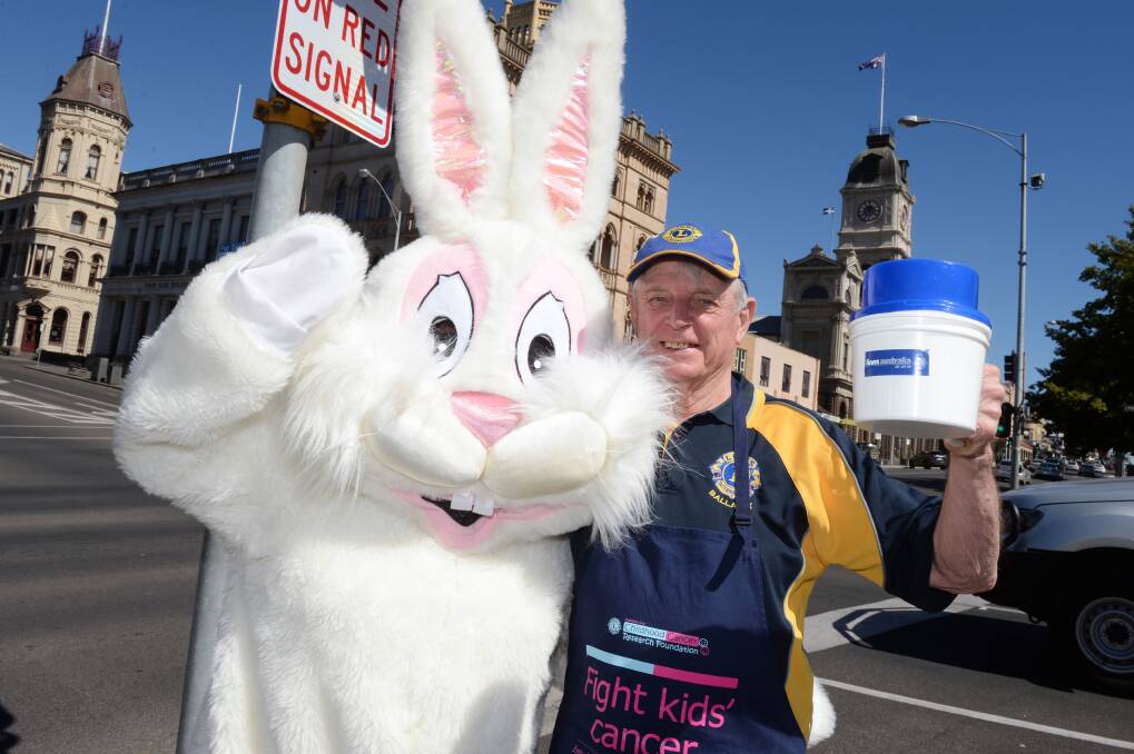 HOP TO IT: The Easter Bunny is back supporting the Ballarat Lions Club and president Bill Sleep in raising money for kids with cancer. Picture: Kate Healy