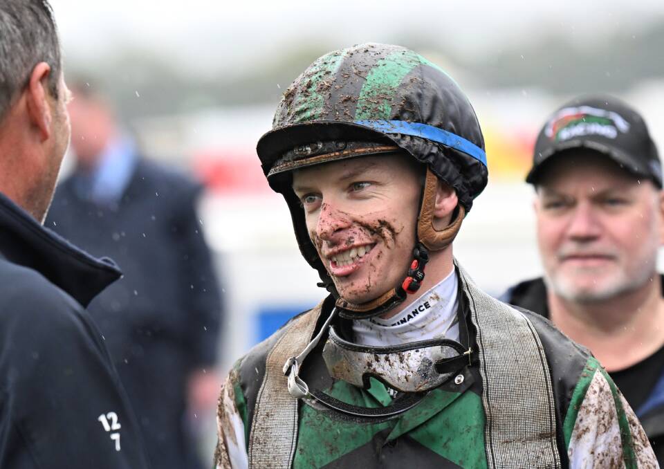 A muddied jockey Michael Dee after winning the Ballarat Cup. Picture by Lachlan Bence