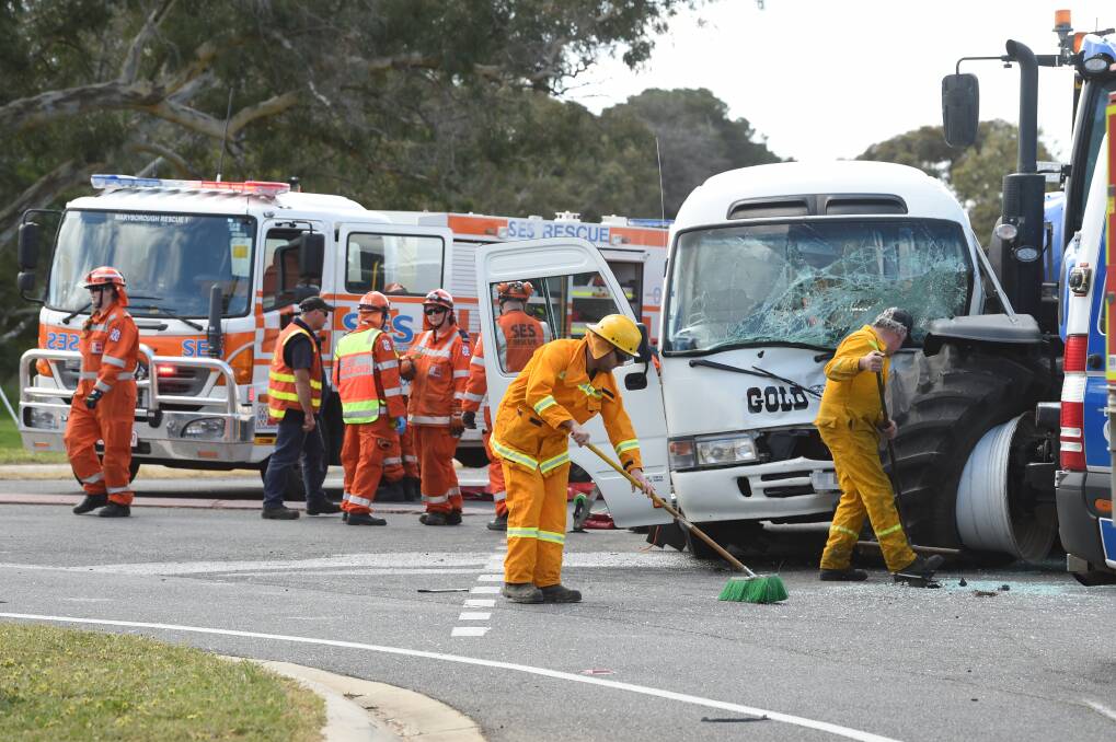 BIG CLEAN: Emergency services work to clean the scene of a bus and tractor crash at Lexton on Friday afternoon. Emergency services ended up using land lines at the general store to phone out. Picture: Kate Healy