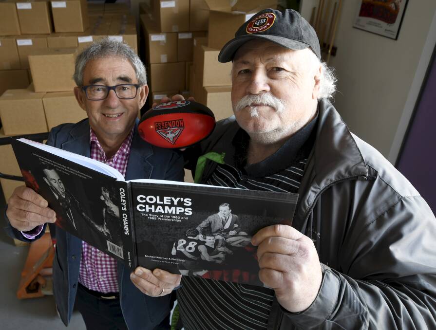 BOMBER BOOK: Ballarat authors Michael Kearney and Phil Hoey have written a book about the Essendon premiership teams coached by John Coleman. Picture: Lachlan Bence