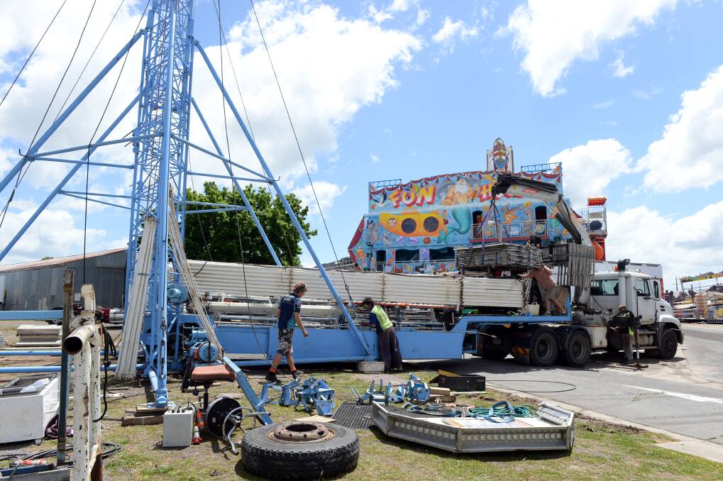 Workers were hard at work putting up the Ballarat Show attractions on Wednesday. Picture: Kate Healy