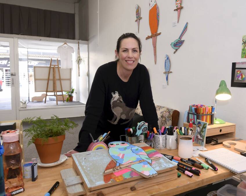 CREATIVE: Katie Chancellor in her Bridge Mall studio has been creating a series of brightly coloured birds during the lockdown. Picture: Lachlan Bence