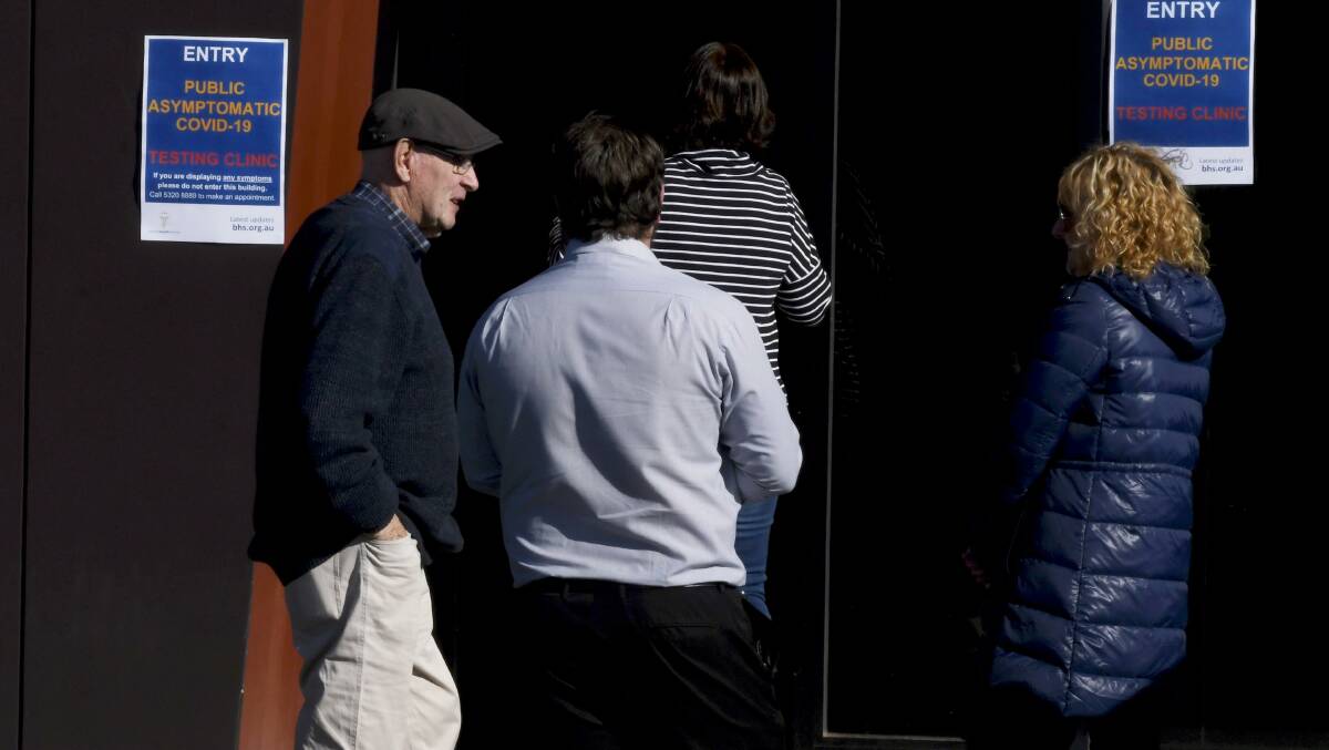 Ballarat residents line up outside the pop-up testing centre at Morshead Park. Picture: Lachlan Bence