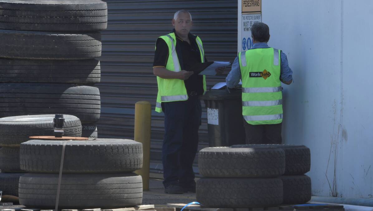 WorkSafe inspectors on the scene the day after Mr Suckling's death. Picture: Lachlan Bence