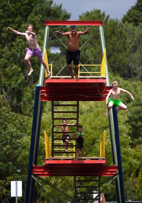 LEAP: Zach, 'Warrior' Jed Mildon and Zane jump off the Creswick Towers. Picture: Adam Trafford
