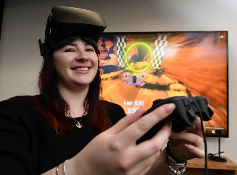 Casey Thomas playing Drone Legion, a game that her production company Dark Shadow has produced. Ballarat gamers will have an opportunity to play the game for free this weekend. Picture: Lachlan Bence