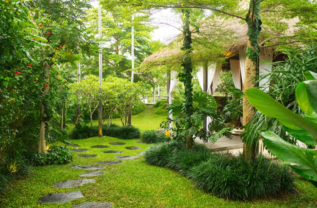 For a Bali-inspired garden think lush plants, water features and ornaments.