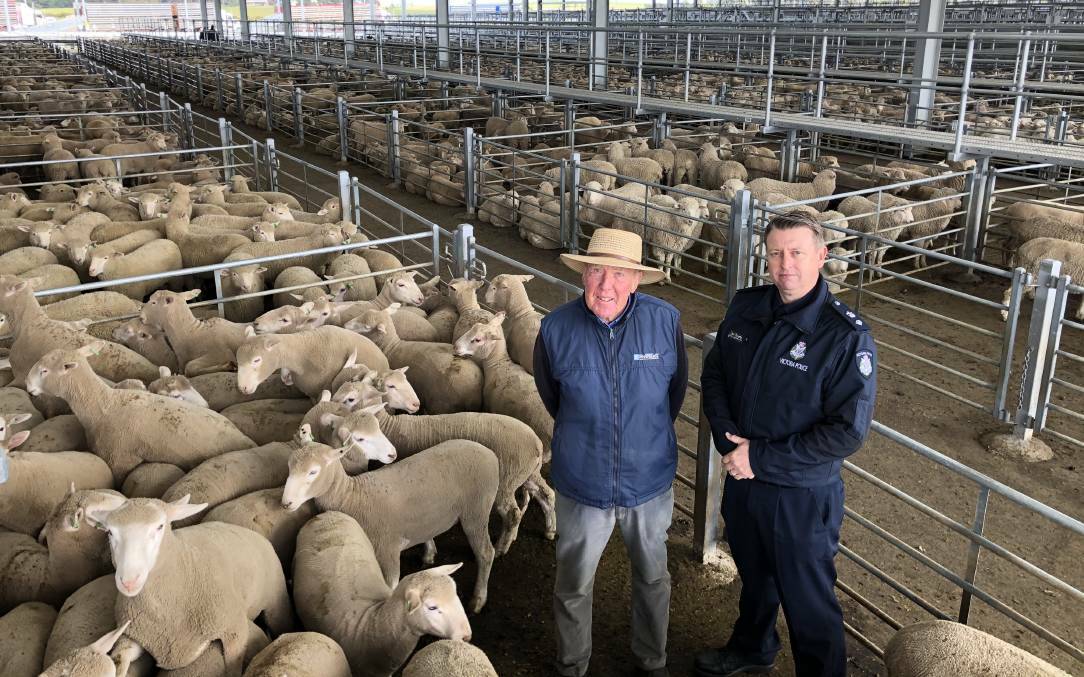 DISCUSSING CONCERNS: Livestock manager Peter McConachy and Inspector Dan Davison launch the farm crime campaign. Picture: Greg Gliddon