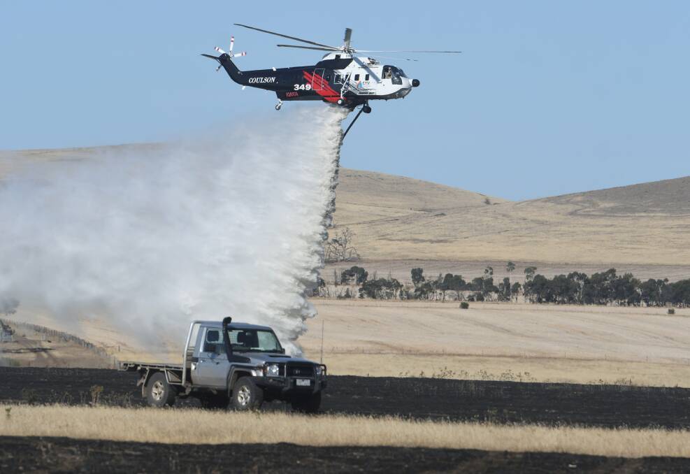 The air wing supports firefighters on the ground in Clunes in late January, 2020. Photo: Lachlan Bence
