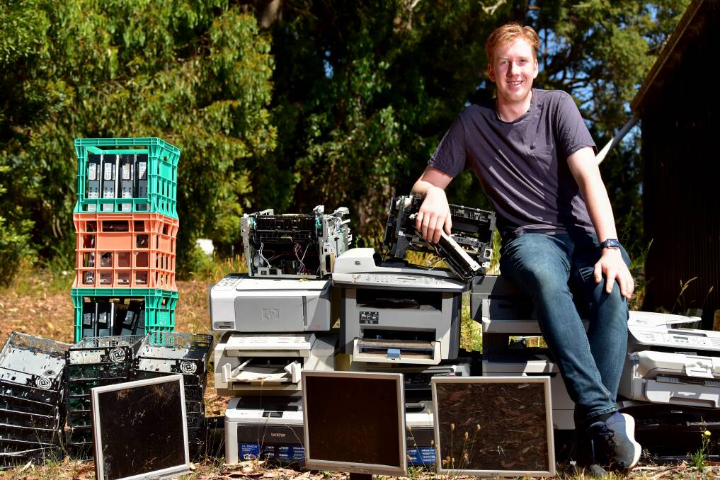 READY TO RECYCLE: Young recycler Albert Smallwood with his sorted e-waste products. Photo: Brendan McCarthy