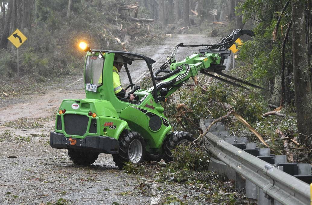 Crews began clearing roads in the days after the storm. Photos: Lachlan Bence