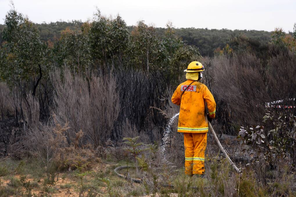 A firefighter fighting a different suspicious fire at Mount Clear last month. Photo: Adam Trafford
