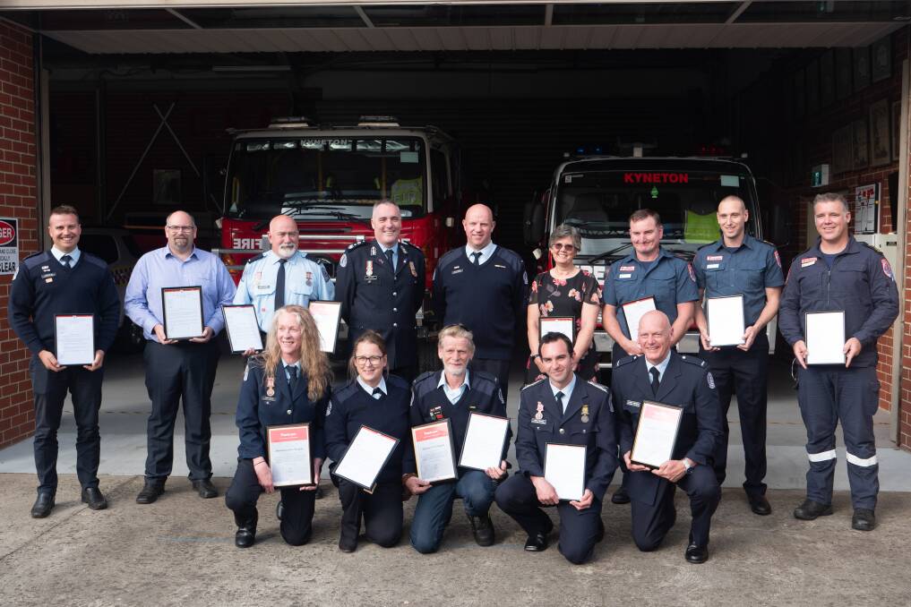 The group of firefighters and paramedics which received the commendations.