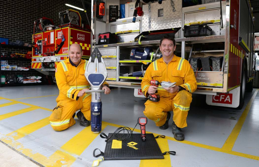 NEW TOOLS: Ballarat Fire Brigade's Captain Mark Cartledge and Damien Scott with new battery-operated equipment earlier this year. Photo: Kate Healy