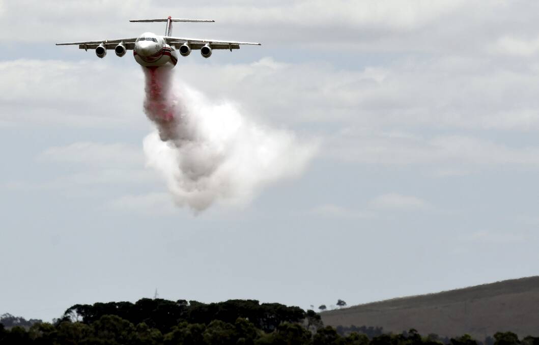 An AVRO RJ85 air tanker drops its load at Ballarat airport last month. Photo: Lachlan Bence
