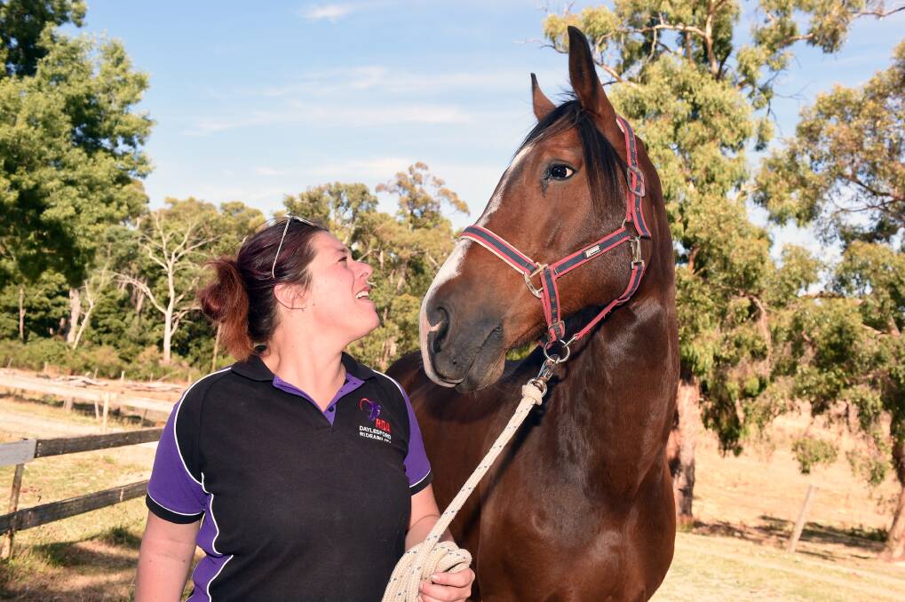 PASSION: Daylesford RDA Vice President Lainey Curr with Leroy the horse. Photo: Kate Healy