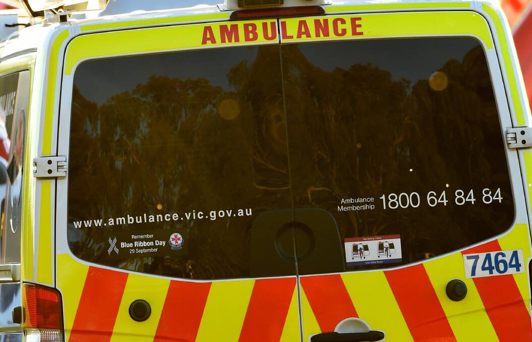 Paramedics treating woman for head injury, believed to be caused from falling from horse