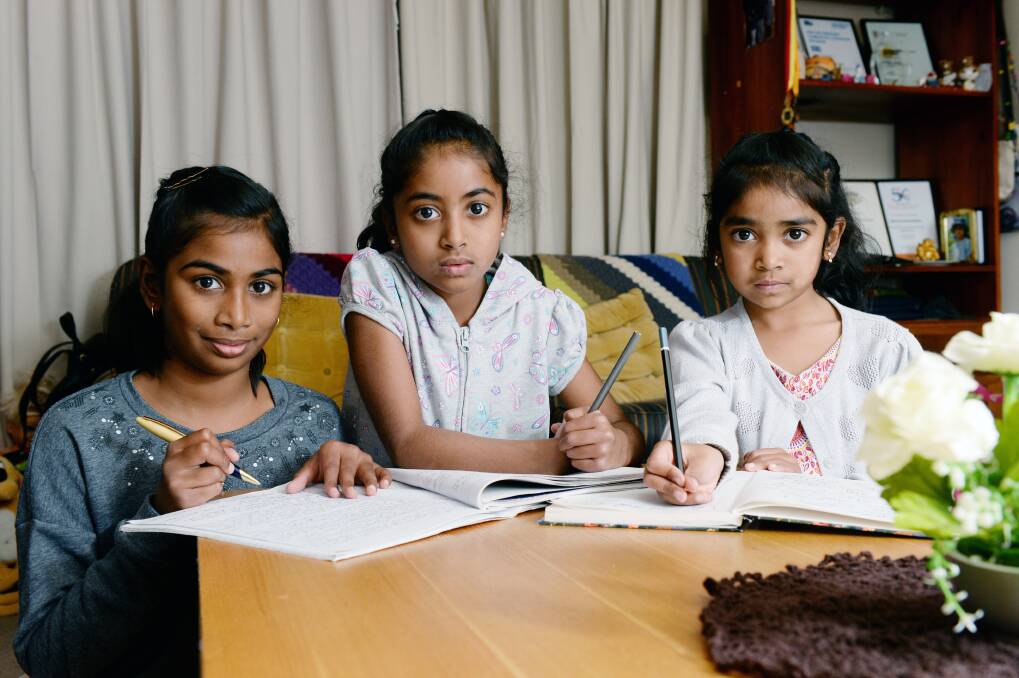 PLEA: Sisters Nivash Neelavannan (11), Kartie Neelavannan (8.5) and Nive Neelavannan (6) have each written a letter to Prime Minister Scott Morrison. Photo: Kate Healy
