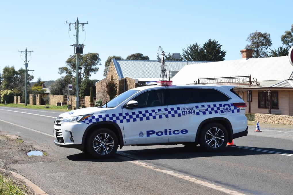Police set-up a road block on the Midland Highway. Photo: Kate Healy