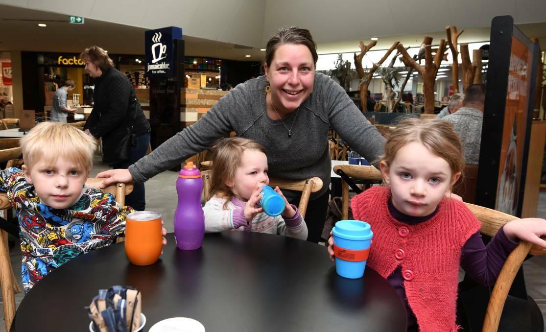 EASY TO ADAPT: Max Mooly, five, Eliza Elliott, two, Nicole Elliott and Annabella Elliott, five, with their reusable cups. Photo: Lachlan Bence