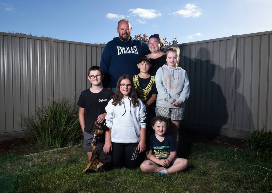 The family all made it out safely, including dog Chev. Photo: Adam Trafford