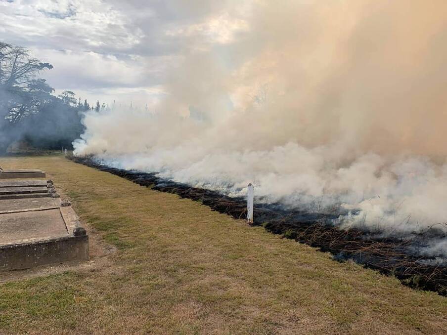 Smoke issuing from the fire at the cemetery site. Photo: Robert Ladd