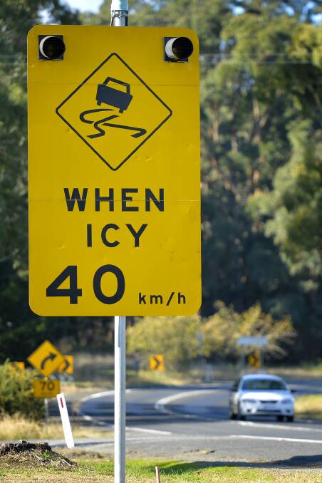 WARNING: A black ice sign with lights at the Eganstown entrance to Daylesford. Photo: Dylan Burns