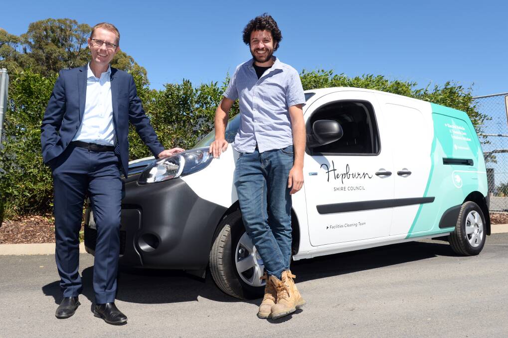 Hepburn Shire CEO Evan King with sustainability officer Dominic Murphy and the council's electric car. Photo: Kate Healy