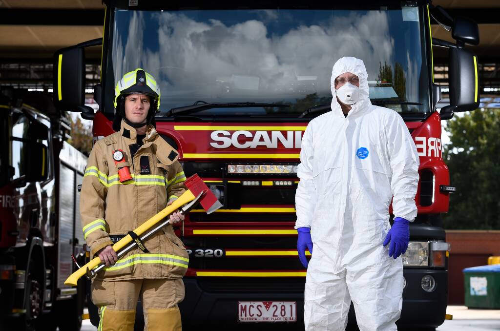 PROTECTED: Ballarat City Fire Brigade's Matt MacGillivray and Tom Hildebrandt wearing personal protective equipment. Photo: Adam Trafford