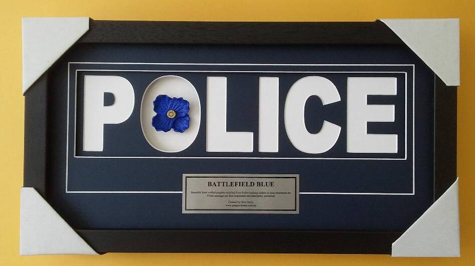 The framed poppy and plaque handed to Ballarat Police. Photo: Supplied