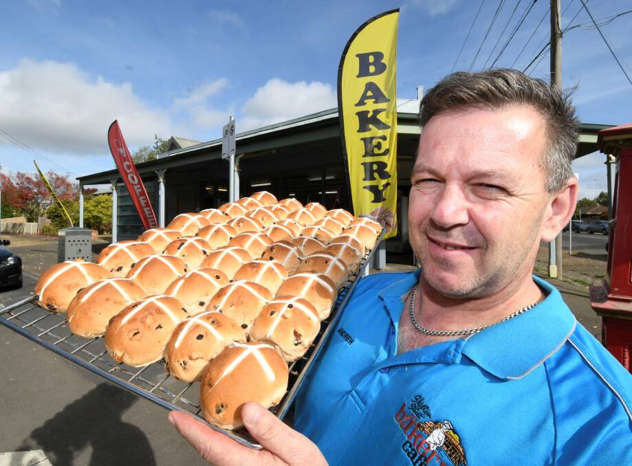EASTER TREAt: Owner of Skipton Street Bakery Cafe Andrew Juggins with a fresh batch. Photo: Lachlan Bence