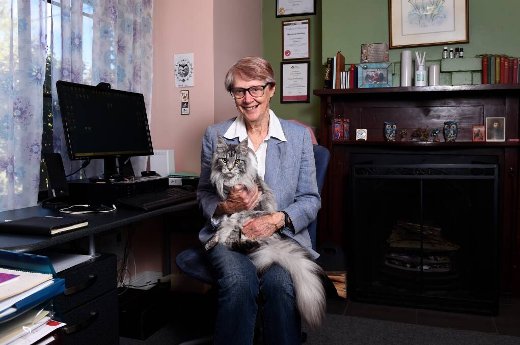 FELINE FRIEND: Counsellor Marguerite Middling and her therapy cat Buddy who helps clients relax while in their sessions. Photo: Adam Trafford