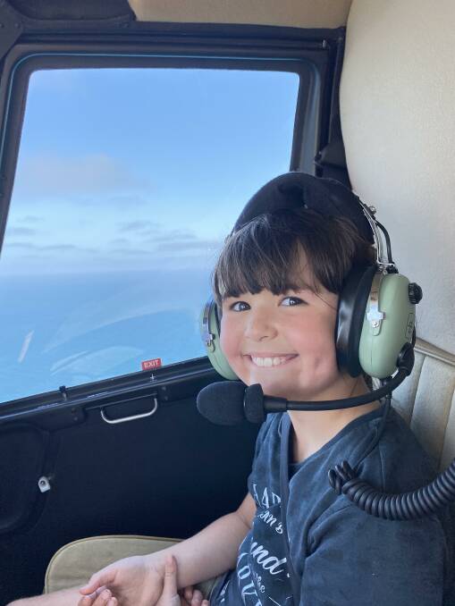 THRILLED: An excited Rosie in the air with Geelong Helicopters. Photo: Supplied