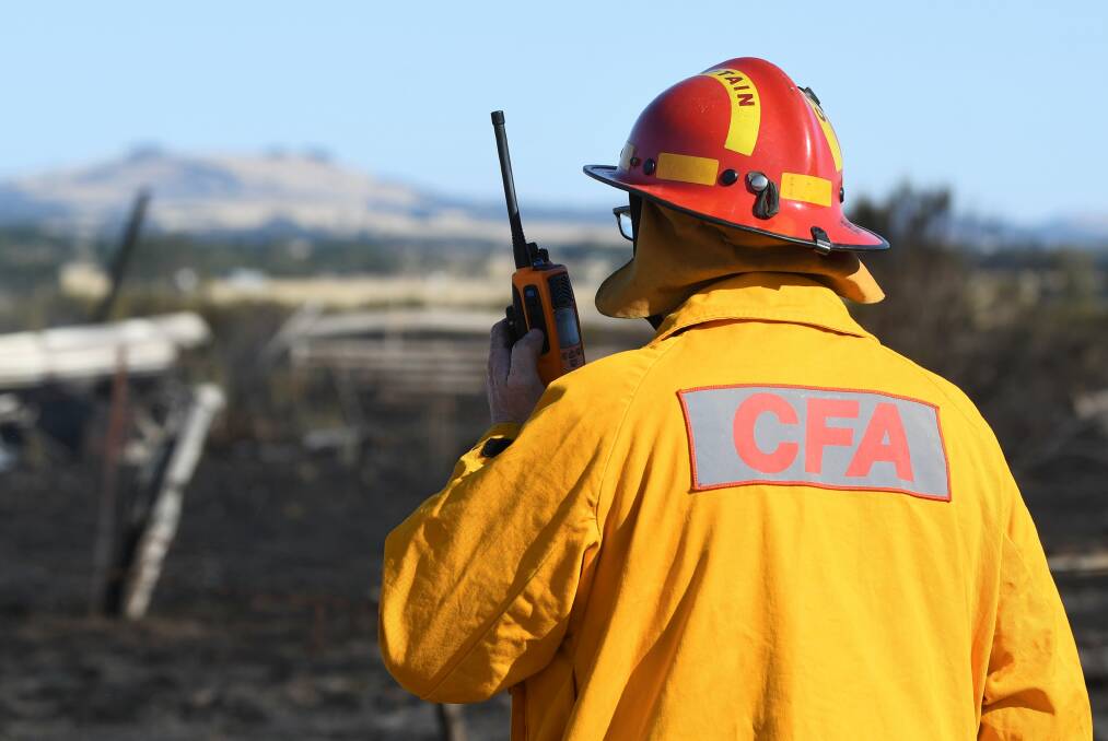 A firefighter at the scene of the Clunes fire at Albert Street. Photo: Lachlan Bence