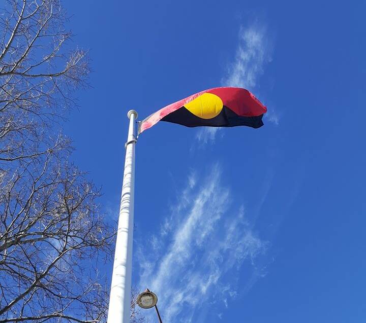 An Aboriginal flag was raised in Daylesford to mark National Sorry Day on Tuesday. Photo: Hepburn Shire Council