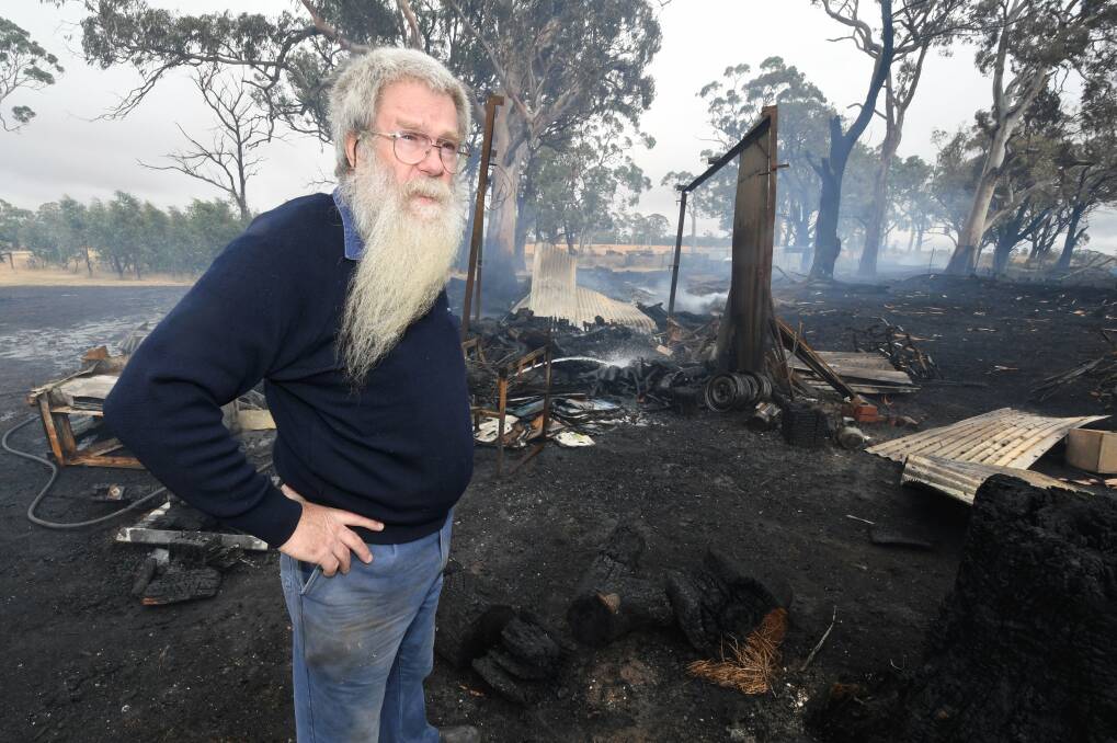BURNT: Resident Glenn McKechnie lost a large shed in Wednesday's fire. Photo: Lachlan Bence