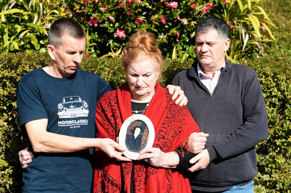 FAMILY: Belinda Williams' brother Sean Macey, mother Shirley Macey and brother Nat Watchorn with a framed photograph of her. Photo: Kate Healy