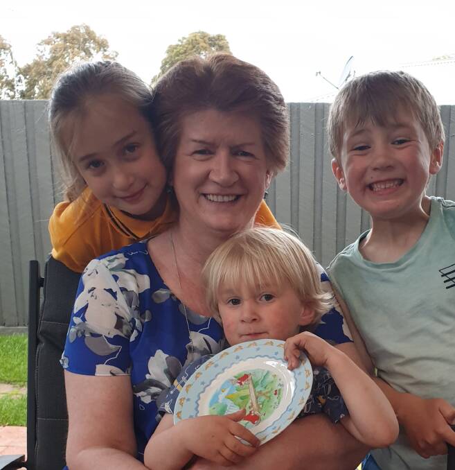 HAPPY MEMORIES: Angela Loader on her birthday, celebrating with her three beloved grandchildren Emily, Thomas and Harrison. Photos: Supplied